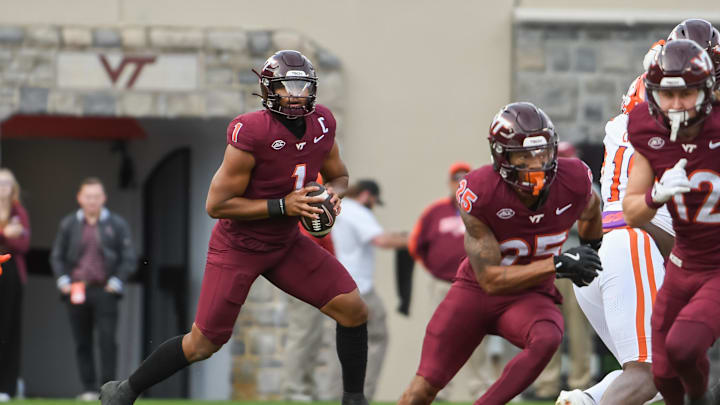 Nov 9, 2024; Blacksburg, Virginia, USA;  Virginia Tech Hokies quarterback Kyron Drones (1) looks to pass the ball against the Clemson Tigers during the second quarter at Lane Stadium. Mandatory Credit: Brian Bishop-Imagn Images