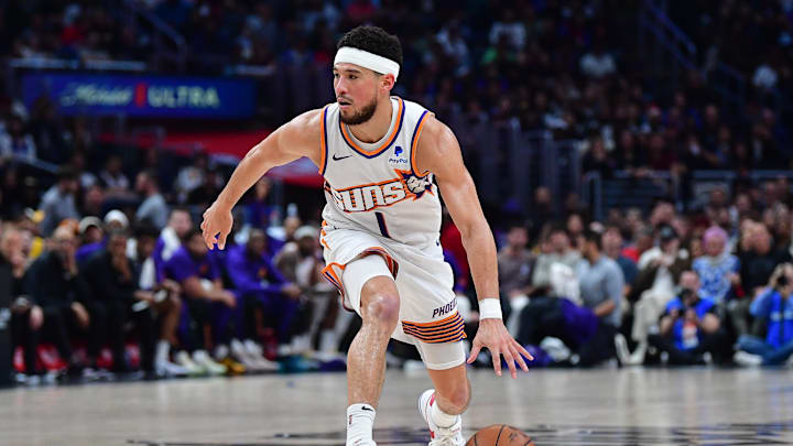 Apr 10, 2024; Los Angeles, California, USA; Phoenix Suns guard Devin Booker (1) moves the ball