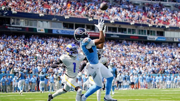 Tennessee Titans wide receiver Elic Ayomanor (5) pulls down a touchdown ahead of Los Angeles Rams cornerback Emmanuel Forbes Jr. (1) during the second quarter at Nissan Stadium in Nashville, Tenn., Sunday, Sept. 14, 2025.