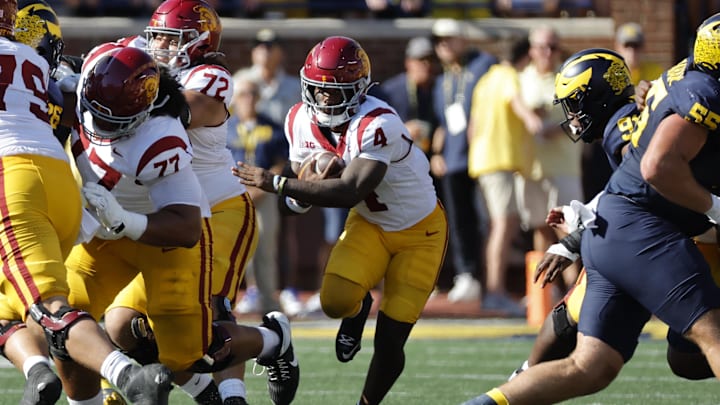 Sep 21, 2024; Ann Arbor, Michigan, USA;  USC Trojans running back Woody Marks (4) rushes in the first half against the Michigan Wolverines at Michigan Stadium.