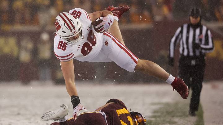 Nov 29, 2025; Minneapolis, Minnesota, USA; Minnesota Golden Gophers defensive back John Nestor (17) tackles Wisconsin Badgers tight end Lance Mason (86) during the second half at Huntington Bank Stadium. Mandatory Credit: Matt Krohn-Imagn Images