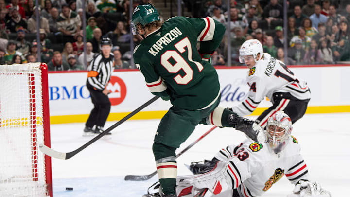 Oct 1, 2024; Saint Paul, Minnesota, USA; Minnesota Wild left wing Kirill Kaprizov (97) beats Chicago Blackhawks goaltender Drew Commesso (33) but the puck does not go in the goal in the second period at Xcel Energy Center. Mandatory Credit: Matt Blewett-Imagn Images