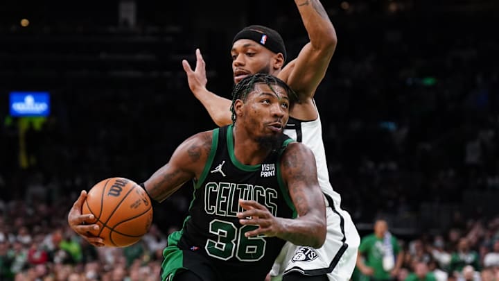 Apr 17, 2022; Boston, Massachusetts, USA; Boston Celtics guard Marcus Smart (36) drives the ball against Brooklyn Nets forward Bruce Brown (1) in the second half during game one of the first round for the 2022 NBA playoffs at TD Garden. Mandatory Credit: David Butler II-Imagn Images