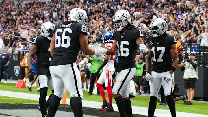 Nov 5, 2023; Paradise, Nevada, USA; Las Vegas Raiders wide receiver Jakobi Meyers (16) celebrates with Las Vegas Raiders guard Dylan Parham (66) after scoring a touchdown against the New York Giants during the first quarter at Allegiant Stadium. Mandatory Credit: Stephen R. Sylvanie-Imagn Images