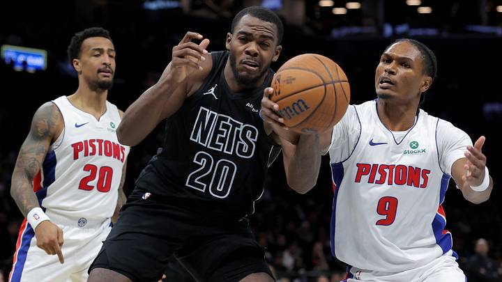 Oct 30, 2026; Brooklyn, New York, USA; Brooklyn Nets center Day'ron Sharpe (20) fights for a rebound against Detroit Pistons guard Ausar Thompson (9) and forward John Collins (20) during the second quarter at Barclays Center. Mandatory Credit: Brad Penner-Imagn Images