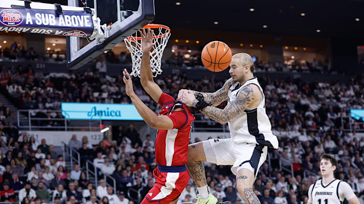 COLLEGE BASKETBALL: FEB 14 St. John's at Providence; Providence's Duncan Powell fouls St. John's basketball forward Bryce Hopkins