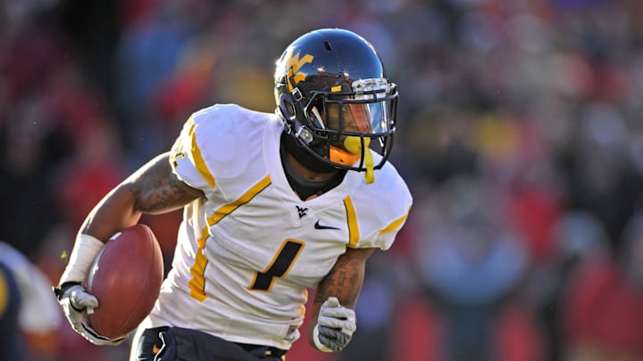 Nov 23, 2012; Ames, Iowa, USA; West Virginia Mountaineers running back Tavon Austin (1) rushes down field against the Iowa State Cyclones during the first half at Jack Trice Stadium.  Mandatory Credit: Peter G. Aiken-Imagn Images
