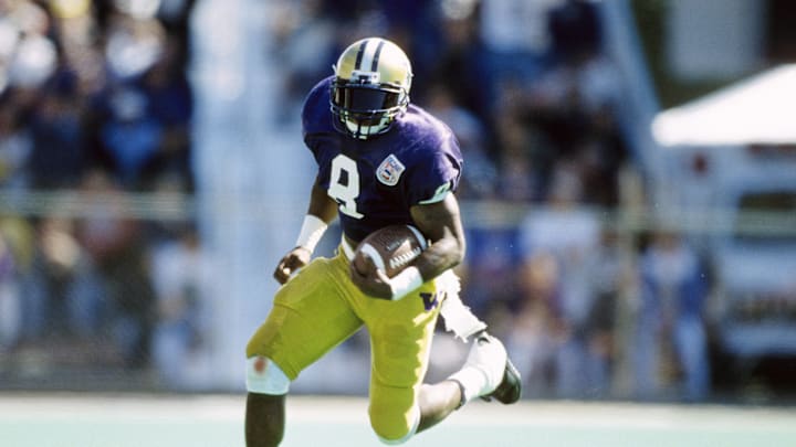Sep 10, 1994; Seattle, WA USA; FILE PHOTO; Washington Huskies running back Napoleon Kaufman (8) carrying the ball against the Ohio State Buckeyes at Husky Stadium. Mandatory Credit: Imagn Images 