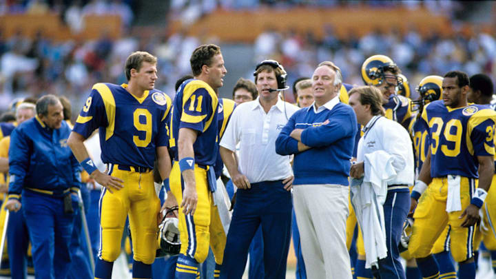 Nov 13, 1988; Anaheim, CA, USA; FILE PHOTO; Los Angeles Rams head coach John Robinson (right) assistant coach Norv Turner (center) and quarterback Jim Everett (11) and Mark Herrmann (9) on the sidelines against the New Orleans Saints at Anaheim Stadium. Mandatory Credit: Photo By Imagn Images