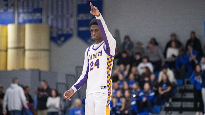 Camden's Billy Richmond reacts after a Camden basket during the boys basketball game between Camden