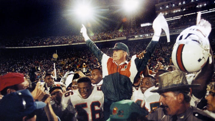 Jan 1, 1992; Miami, FL, USA; FILE PHOTO; Miami Hurricanes head coach Dennis Erickson carried off the field after a 22-0 victory over the Nebraska Cornhuskers during the 1992 Orange Bowl. Mandatory Credit: Imagn Images