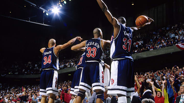 Mar 21, 1997; Birmingham, AL, USA; FILE PHOTO; Arizona Wildcats guard Miles Simon (34), forward Bennett Davison (21), forward Eugene Edgerson (33) and guard Jason Terry (31) celebrate on the sidelines after defeating the Kansas Jayhawks 85-82 during the NCAA regional semifinals at the Birmingham-Jefferson Civic Center. Mandatory Credit: RVR Photos-Imagn Images Mar 21, 1997; Birmingham, AL, USA; FILE PHOTO; Arizona Wildcats guard Miles Simon (34), forward Bennett Davison (21), forward Eugene Edgerson (33) and guard Jason Terry (31) celebrate on the sidelines after defeating the Kansas Jayhawks 85-82 during the NCAA regional semifinals at the Birmingham-Jefferson Civic Center. Mandatory Credit: RVR Photos-Imagn Images