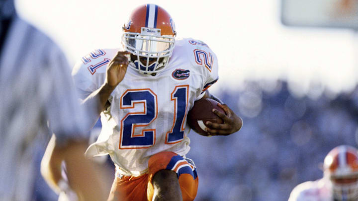 Sep 27, 1997; Lexington, KY, USA; FILE PHOTO; Florida Gators running back  Fred Taylor (21) carries the ball against the Kentucky Wildcats at Commonwealth Stadium. Mandatory Credit: RVR Photos-Imagn Images 