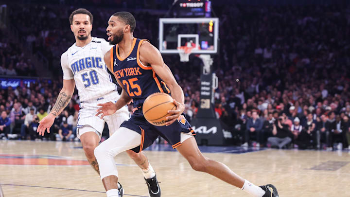 Jan 6, 2025; New York, New York, USA;  New York Knicks forward Mikal Bridges (25) drives past Orlando Magic guard Cole Anthony (50) in the first quarter at Madison Square Garden. Mandatory Credit: Wendell Cruz-Imagn Images
