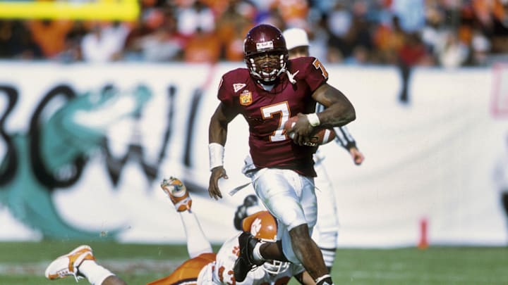 Jan 1, 2001; Jacksonville, FL, USA: FILE PHOTO; Virginia Tech Hokies quarterback Michael Vick (7) in action against the Clemson Tigers during the 2001 Gator Bowl at Alltel Stadium.  Mandatory Credit: Imagn Images