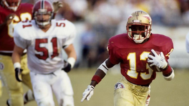 Nov 4 1989; Tallahassee, FL, USA; FILE PHOTO; Florida State Seminoles running back Dexter Carter (13) carrying the ball against the South Carolina Gamecocks at Doak Campbell Stadium. Mandatory Credit: RVR Photos-Imagn Images 
