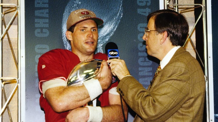 Jan 29, 1995; Miami, FL, USA; FILE PHOTO; San Francisco quarterback Steve Young (8) holds the Lombardi trophy while talking with sportscaster Brent Musburger after winning Super Bowl XXIX at Joe Robbie Stadium against the San Diego Chargers. Young set a Super Bowl record with 6 touchdown passes and was named the games most valuable player. The 49ers defeated the Chargers 49-26. Mandatory Credit: RVR Photos-USA TODAY NETWORK Jan 29, 1995; Miami, FL, USA; FILE PHOTO; San Francisco quarterback Steve Young (8) holds the Lombardi trophy while talking with sportscaster Brent Musburger after winning Super Bowl XXIX at Joe Robbie Stadium against the San Diego Chargers. Young set a Super Bowl record with 6 touchdown passes and was named the games most valuable player. The 49ers defeated the Chargers 49-26. Mandatory Credit: RVR Photos-USA TODAY NETWORK