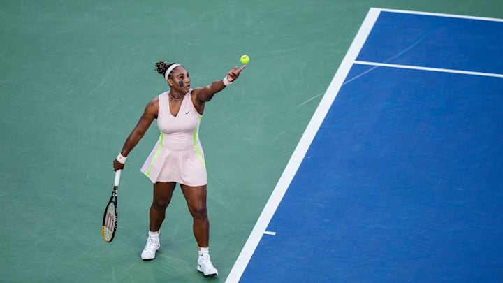 Serena Williams prepares to serve to Emma Raducanu during the Western & Southern Open at the
