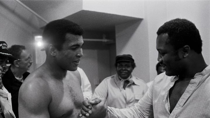 Sep 13, 1978; New Orleans, LA, USA; FILE PHOTO; Muhammad Ali (left) shares a laugh with Joe Frazier