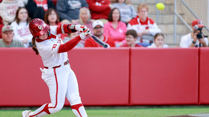 Oklahoma catcher Kendall Wells hits a home run at Love's Field. Oklahoma catcher Kendall Wells hits a home run at Love's Field.