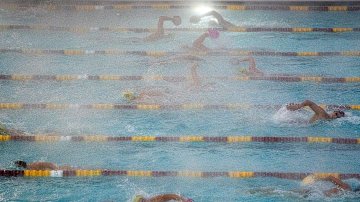 ASU swim team members cut through the rising steam on Dec. 14, 2022, during practice at ASU's Mona Plummer Aquatic Center in Tempe. The temperature during the 6-8 a.m. practice was 37 degrees, and the water temperature was 80 degrees.

Cold