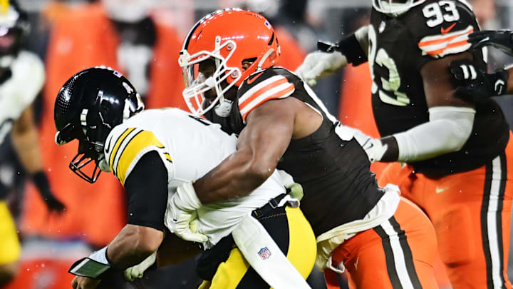 Nov 21, 2024; Cleveland, Ohio, USA; Cleveland Browns defensive end Myles Garrett (95) sacks Pittsburgh Steelers quarterback Russell Wilson (3) during the first quarter at Huntington Bank Field. Mandatory Credit: Ken Blaze-Imagn Images