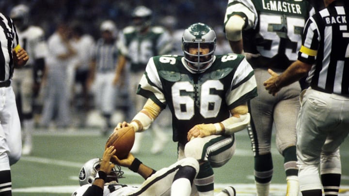 Jan 25, 1981; New Orleans, LA, USA; FILE PHOTO; Philadelphia Eagles linebacker Bill Bergey (66) kneels over Oakland Raiders tight end Raymond Chester (88) in Super Bowl XV at the Superdome. The Raiders defeated the Eagles 27-10. Mandatory Credit: Manny Rubio-Imagn Images