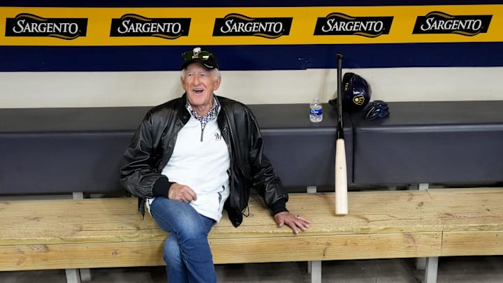 Milwaukee Brewers play-by-play announcer Bob Uecker sits in the dugout while players workout at American Family Field in Milwaukee on April 6, 2022.