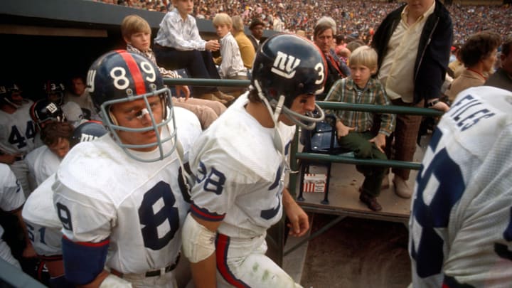 Nov 1971; Unknown Location, USA; FILE PHOTO; New Yorks Giants defensive end (89) Fred Dryer and tight end (38) Bob Tucker take the field during the 1971 season. 