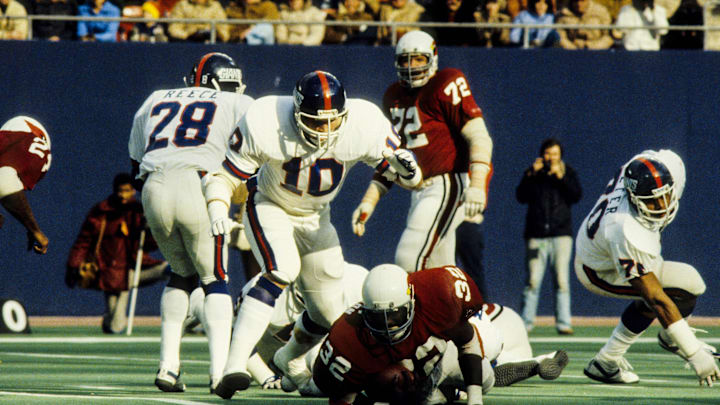 Nov 30, 1980; East Rutherford, NJ, USA; FILE PHOTO; New York Giants defensive players Beasley Reece (28), Brad Van Pelt (10) and Gary Jeter (70) in action against St. Louis Cardinals running back Ottis Anderson (32) and tackle Dan Dierdorf (72) at Giants Stadium.  