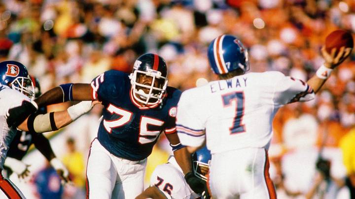 Jan 25, 1987; Pasadena, CA, USA; FILE PHOTO; New York Giants Defensive End #75 GEORGE MARTIN pressures Denver Broncos Quarterback #7 JOHN ELWAY during Super Bowl XXI at the Rose Bowl. The Giants defeated the Broncos 39-20. Jan 25, 1987; Pasadena, CA, USA; FILE PHOTO; New York Giants Defensive End #75 GEORGE MARTIN pressures Denver Broncos Quarterback #7 JOHN ELWAY during Super Bowl XXI at the Rose Bowl. The Giants defeated the Broncos 39-20.
