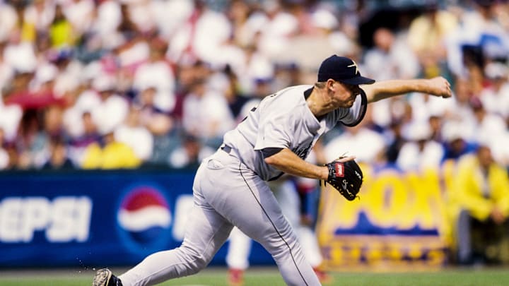 Former Houston Astros pitcher Billy Wagner throws a pitch wearing a gray jersey and black hat. Former Houston Astros pitcher Billy Wagner throws a pitch wearing a gray jersey and black hat.