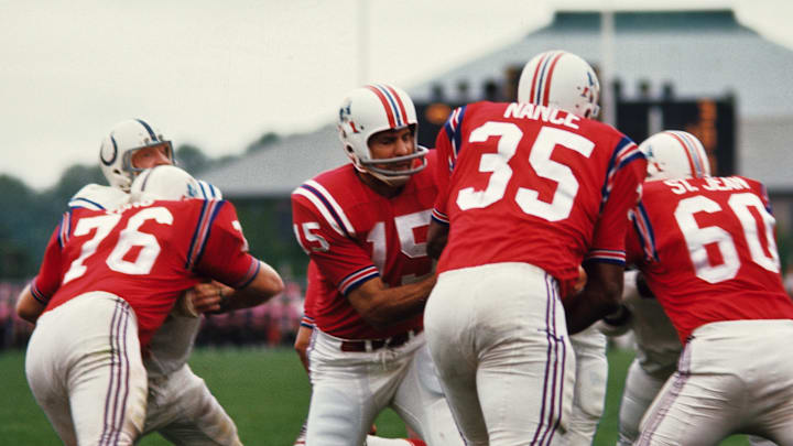 Aug 1967; Unknown location, USA; FILE PHOTO; Boston Patriots quarterback Babe Parilli (15) hands the ball off to running back Jim Nance (35) behind the blocking of Charley Long (76) and Len St. Jean (60) against the Baltimore Colts during the 1967 preseason. Mandatory Credit: Tony Tomsic-USA TODAY NETWORK Aug 1967; Unknown location, USA; FILE PHOTO; Boston Patriots quarterback Babe Parilli (15) hands the ball off to running back Jim Nance (35) behind the blocking of Charley Long (76) and Len St. Jean (60) against the Baltimore Colts during the 1967 preseason. Mandatory Credit: Tony Tomsic-USA TODAY NETWORK