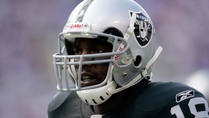 Sep 17, 2006; Baltimore, MD, USA; Oakland Raiders wide receiver Randy Moss (18) looks on against the Baltimore Ravens at M&T Bank Stadium. Credit: Lou Capozzola-USA TODAY NETWORK