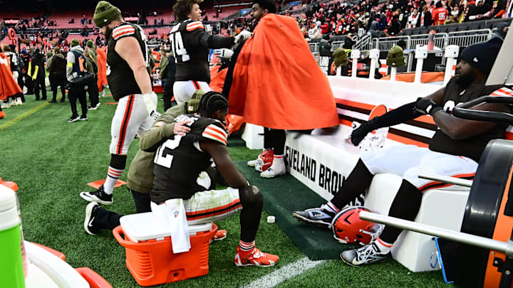 Shedeur Sanders (is consoled by a Browns staffer during a blowout loss.
