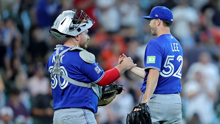 Toronto Blue Jays catcher Alejandro Kirk (left) and pitcher Chase Lee (right). Toronto Blue Jays catcher Alejandro Kirk (left) and pitcher Chase Lee (right).