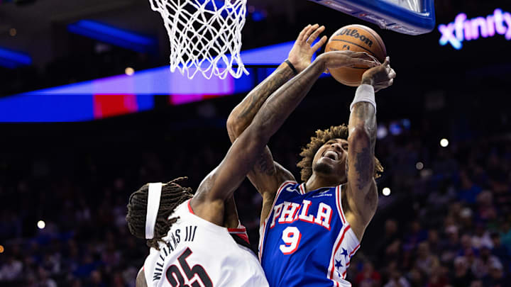 Oct 29, 2023; Philadelphia, Pennsylvania, USA; Philadelphia 76ers guard Kelly Oubre Jr. (9) is fouled by Portland Trail Blazers center Robert Williams III (35) while driving for a shot during the fourth quarter at Wells Fargo Center. Mandatory Credit: Bill Streicher-USA TODAY Sports