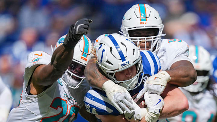 Indianapolis Colts tight end Tyler Warren (84) is brought down by Miami Dolphins linebacker Jordyn Brooks (20) and Miami Dolphins defensive tackle Benito Jones (95) in the game against the Miami Dolphins at Lucas Oil Stadium. Indianapolis Colts tight end Tyler Warren (84) is brought down by Miami Dolphins linebacker Jordyn Brooks (20) and Miami Dolphins defensive tackle Benito Jones (95) in the game against the Miami Dolphins at Lucas Oil Stadium.