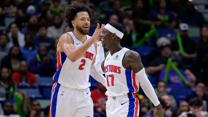 Mar 17, 2025; New Orleans, Louisiana, USA;  Detroit Pistons guard Cade Cunningham (2) celebrates a basket with guard Dennis Schroder (17) against the New Orleans Pelicans during the second half at Smoothie King Center. Mandatory Credit: Matthew Hinton-Imagn Images
