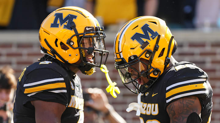 Oct 19, 2024; Columbia, Missouri, USA; Missouri Tigers wide receiver Luther Burden III (3) and running back Jamal Roberts (20) celebrate after a touchdown during the second half against the Auburn Tigers at Faurot Field at Memorial Stadium. Mandatory Credit: Jay Biggerstaff-Imagn Images