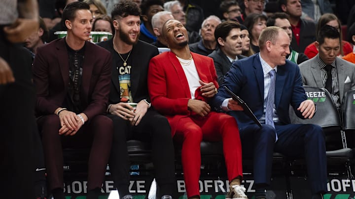 Feb 25, 2020; Portland, Oregon, USA; Portland Trail Blazers guard Damian Lillard (0) (red) laughs on