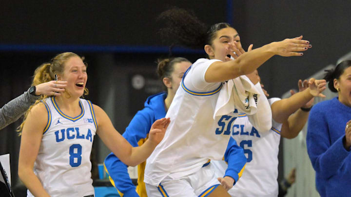 Dec 16, 2025; Los Angeles, California, USA; UCLA Bruins guard Gianna Kneepkens (8) and center Lauren Betts (51) react on the bench after a basket during the second half against the Cal Poly Mustangs at Pauley Pavilion presented by Wescom Financial. Mandatory Credit: Jayne Kamin-Oncea-Imagn Images
