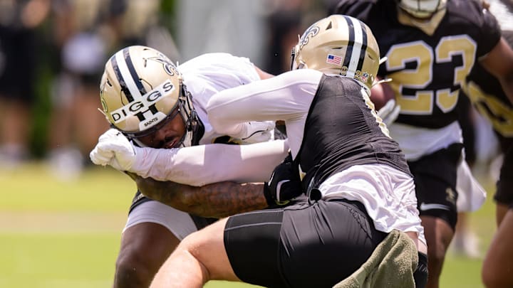 Jun 10, 2025; New Orleans, LA, USA; New Orleans Saints defensive end Fadil Diggs (40) blocks tight end Treyton Welch (82) during punt drills during minicamp at Ochsner Sports Performance Center. Mandatory Credit: Stephen Lew-Imagn Images Jun 10, 2025; New Orleans, LA, USA; New Orleans Saints defensive end Fadil Diggs (40) blocks tight end Treyton Welch (82) during punt drills during minicamp at Ochsner Sports Performance Center. Mandatory Credit: Stephen Lew-Imagn Images