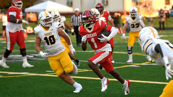 Cardinal Mooney's Raymen Mosley (#1) picks up a first down. Cardinal Mooney played host to Bishop Verot winning 49-28 over Verot at John Heath Field at Austin Smithers Stadium in Sarasota.