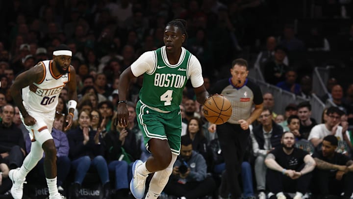 Apr 4, 2025; Boston, Massachusetts, USA; Boston Celtics guard Jrue Holiday (4) brings the ball up the court against the Phoenix Suns during the first quarter at TD Garden. Mandatory Credit: Winslow Townson-Imagn Images