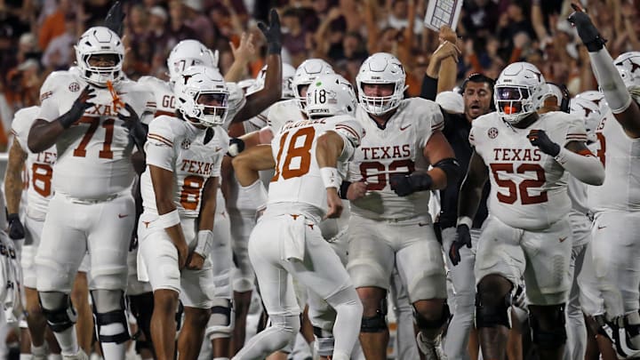 Oct 25, 2025; Starkville, Mississippi, USA; Texas Longhorns quarterback Joe Tatum (18) reacts with teammates after a touchdown during overtime against the Mississippi State Bulldogs at Davis Wade Stadium at Scott Field. Mandatory Credit: Petre Thomas-Imagn Images Oct 25, 2025; Starkville, Mississippi, USA; Texas Longhorns quarterback Joe Tatum (18) reacts with teammates after a touchdown during overtime against the Mississippi State Bulldogs at Davis Wade Stadium at Scott Field. Mandatory Credit: Petre Thomas-Imagn Images