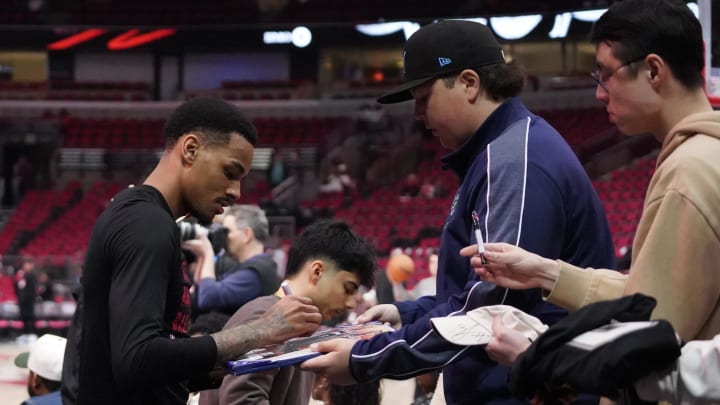 Apr 17, 2024; Chicago, Illinois, USA; Atlanta Hawks guard Dejounte Murray (5) signs autographs before a play-in game of the 2024 NBA playoffs against the Chicago Bulls at United Center. Apr 17, 2024; Chicago, Illinois, USA; Atlanta Hawks guard Dejounte Murray (5) signs autographs before a play-in game of the 2024 NBA playoffs against the Chicago Bulls at United Center.