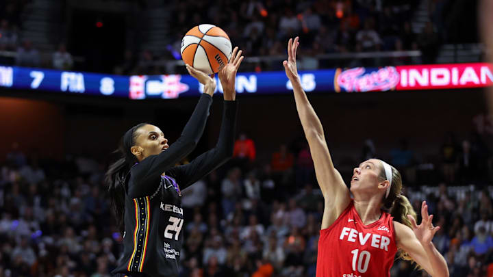 Sep 25, 2024; Uncasville, Connecticut, USA; Connecticut Sun guard DeWanna Bonner (24) shoots defended by Indiana Fever guard Lexie Hull (10) during the second half during game two of the first round of the 2024 WNBA Playoffs at Mohegan Sun Arena.