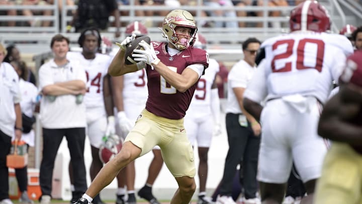 Aug 30, 2025; Tallahassee, Florida, USA; Florida State Seminoles wide receiver Duce Robinson (0) makes a catch against the Alabama Crimson Tide during the first half at Doak S. Campbell Stadium. Mandatory Credit: Melina Myers-Imagn Images