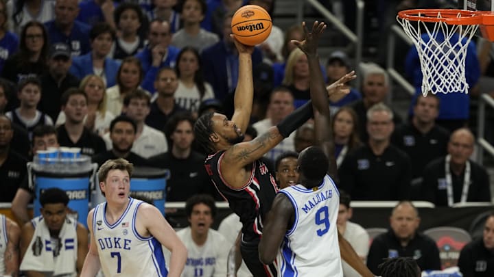 Apr 5, 2025; San Antonio, TX, USA; Houston Cougars forward J'Wan Roberts (13) shoots the ball over Duke Blue Devils center Khaman Maluach (9) during the first half in the semifinals of the men's Final Four of the 2025 NCAA Tournament at Alamodome. Mandatory Credit: Scott Wachter-Imagn Images
